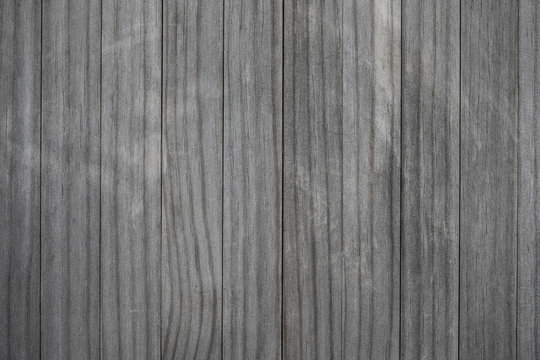 Blank wood pattern wall with grain and scratches. Weathered wood rustic background. Grey brown color Old rough timber..