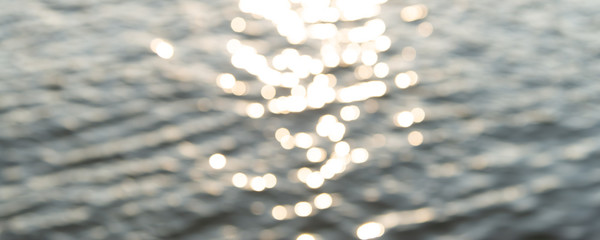 silver bokeh shiny lights, background sunset