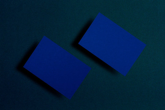 Mock Up Of Two Horizontal Blue Business Cards At Dark Blue Textured Paper Background. Mock-up Template For Branding Identity. For Graphic Designers Presentations And Portfolios