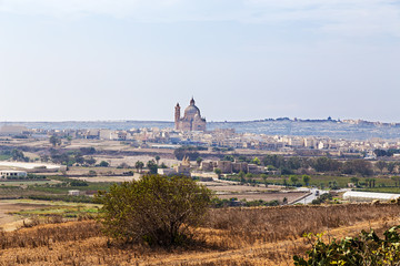 The island of Gozo, Malta. Landscape with a church of St. John the Baptist