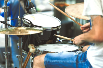Fototapeta na wymiar Drummer detail of a pop group during a show