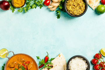 Traditional curry and ingredients on blue background - obrazy, fototapety, plakaty