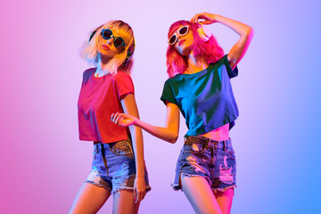 Two DJ Girl Hipster with Fashion Hairstyle Dance.