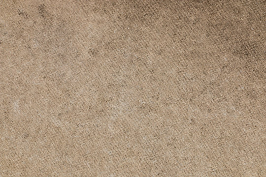 Brown concrete floor texture with small dash pattern. Close-up of speckled grunge background