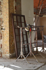 Industrial protective headphones in construction site, industrial under construction empty space, architectural ground work tools