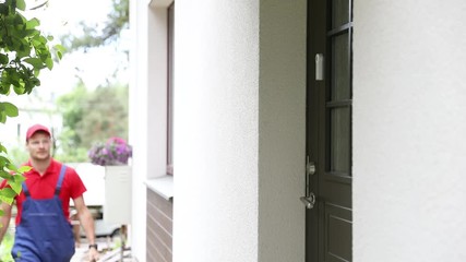 handyman repairman walk to a client house with tool box
