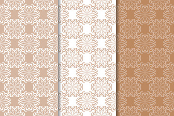 Brown floral backgrounds. Set of seamless patterns