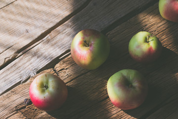 Apples on a wooden background.