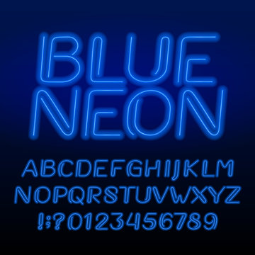 Neon tube alphabet font. Neon color oblique letters and numbers. Retro vector typeface for your design.