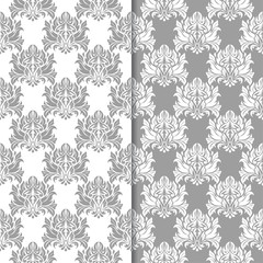 Fototapeta na wymiar White and gray set of floral seamless patterns