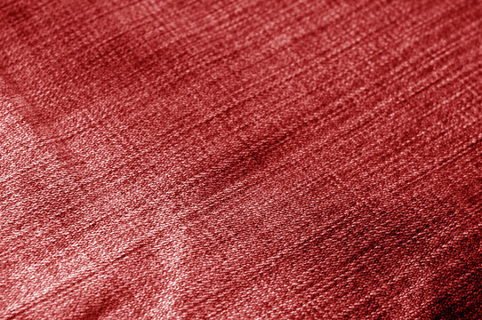 Jeans cloth pattern with blur effect in red tone.