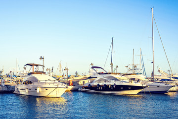 Fototapeta premium Sunset view to rich yachts parked in local port