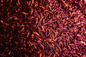 Pile of raw wild rice, black and ready to cook a healthy diet meal