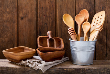 kitchen utensils on wooden shelf