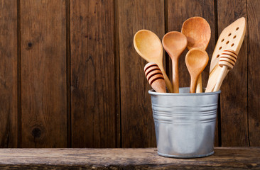 kitchen utensils on wooden shelf