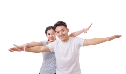 Portrait of flying happy beautiful couple with raised hands up