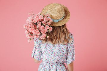 Back view portrait of a young woman in summer dress