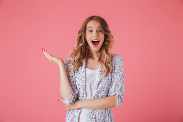 Portrait of an excited young woman in summer dress