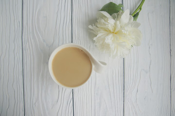 White cup of coffee on a white table  