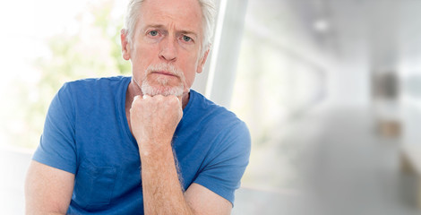 Portrait of pensive senior man