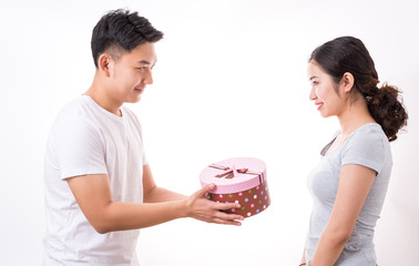 Man giving woman gift. Man handing woman gift. Hand, love.