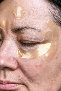 Portrait of mature woman with rejuvenation mask on face