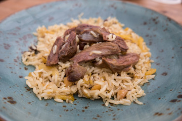 delicious pilaf on a blue plate