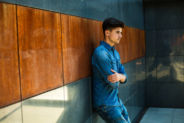 modern guy in jeans inside minimalist chamber