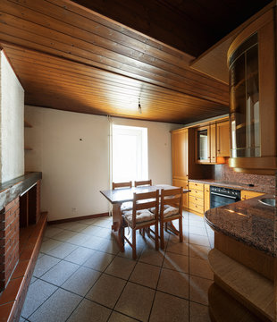 Kitchen with table and wooden furniture