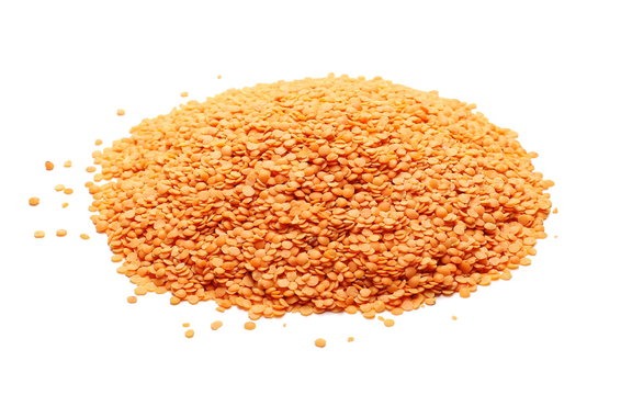 Red lentils, pile isolated on white background and texture 