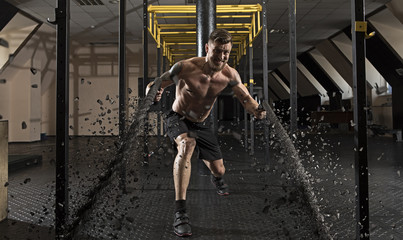 Man working out with battle ropes
