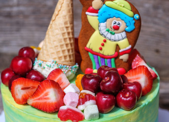 beautiful homemade cake with a funny clown figure