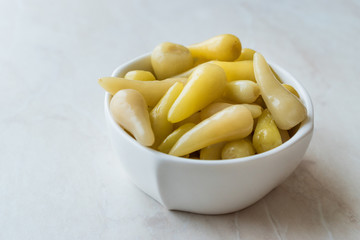 Pickled Green Pepper Pickles in Bowls.