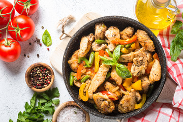 Chicken fried with vegetables.