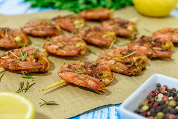 Fried prawns with fresh rosemary. Close-up.