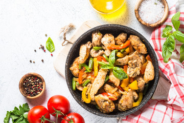 Chicken fried with vegetables.