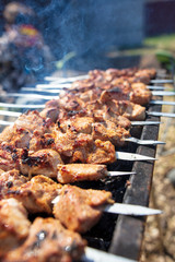 The meat is fried on sticks on charcoal