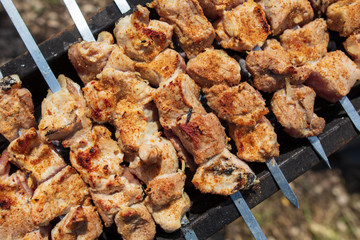 The meat is fried on sticks on charcoal