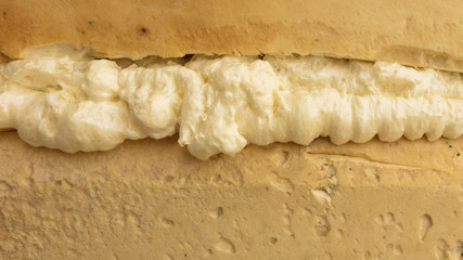 Construction foam in the cracks of the wall at the construction site