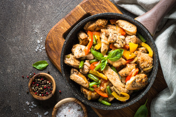 Chicken fried with vegetables.