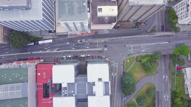 Aerial top down view, new zealand city buildings and roadways in CDB, low traffic morning.