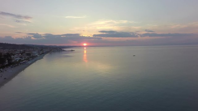 flight over the sea at sunset
