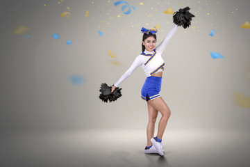 Pretty asian cheerleader in action
