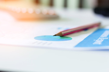 business graph chart and pencil on desk