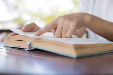 women read book on table, knowledge and wisdom concept