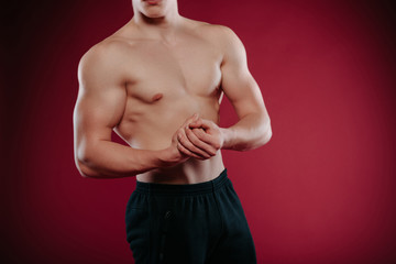 Obraz premium Strong bodybuilder man with perfect abs, shoulders,biceps, triceps, chest.Man showing his muscular body.