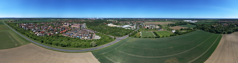 High resolution panorama of fields,meadows and a small village in the north of germany, aerial view