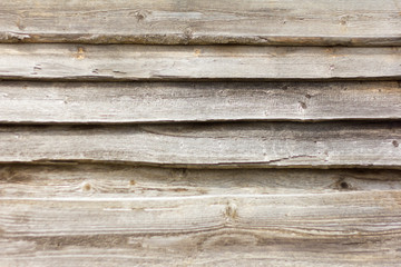 wooden background, wooden wall of thin boards with nails and slits