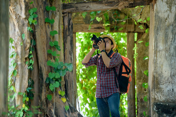 Backpackers or hikers Photography with digital SLR camera in ancient places.