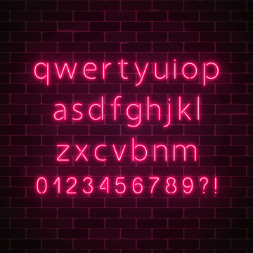 Vector Neon Style Font. Glowing Red Neon Alphabet With Lowercase Letters On Dark Brick Wall Background.